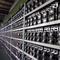 A wide shot of a large mining farm with rows of mining rigs.